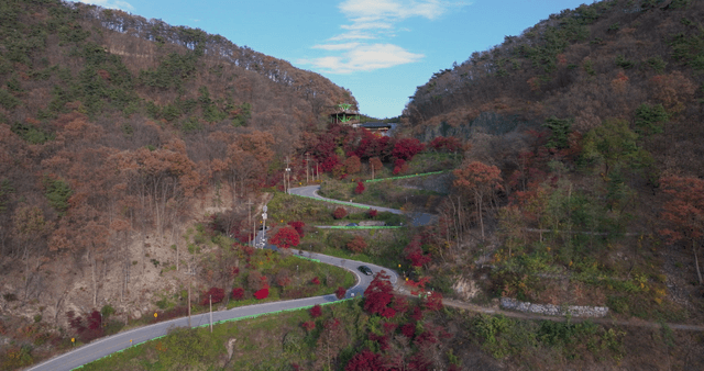 Winding mountain road with autumn foliage