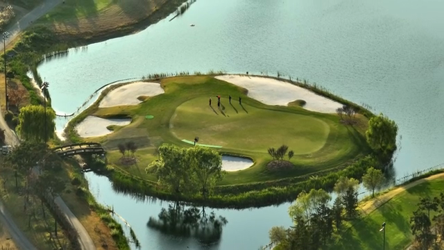 Golfers playing on a sunny course