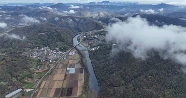 Aerial view of mountains and farmland