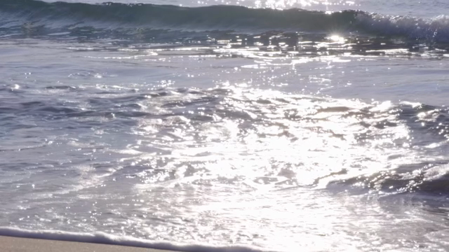 Waves gently crashing on a sunny beach