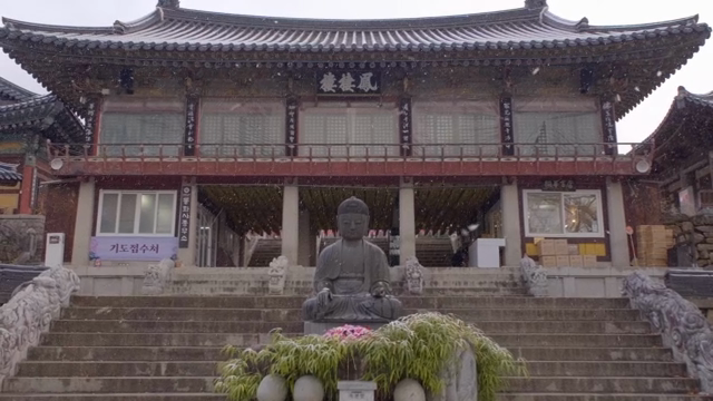 Buddhist temples and statues in snow