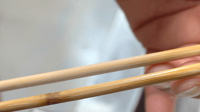 Chopsticks held in a hand