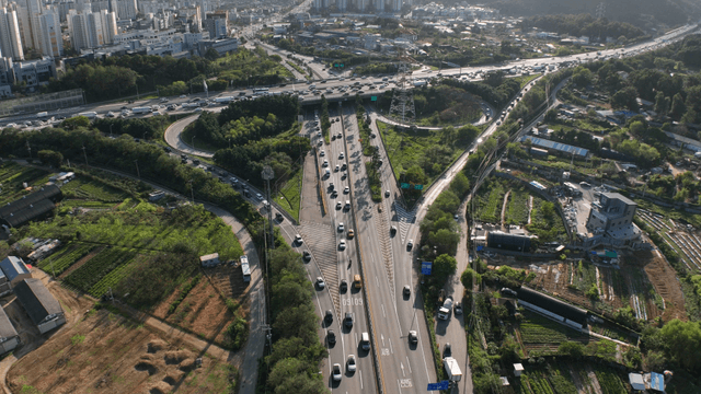 Busy highway intersection passing through agricultural area