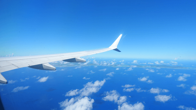 View from an airplane window over the sky