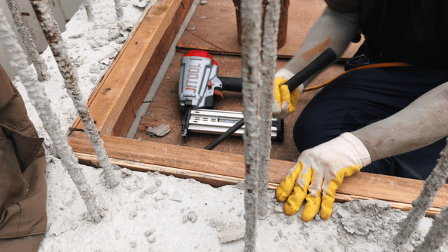 Worker using tools at a construction site