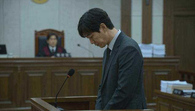 Male defendant expressing remorse in courtroom