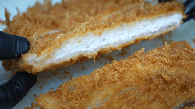 Showing the cross-section of a well-fried pork cutlet