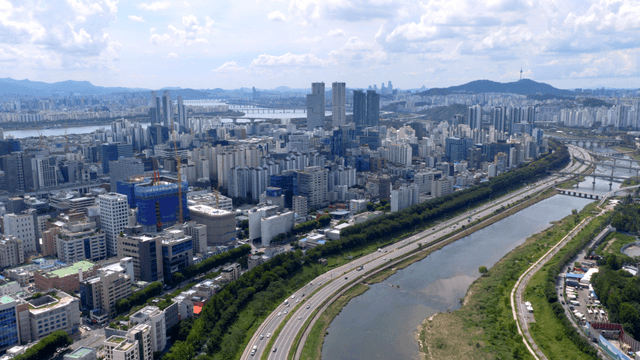 A sprawling cityscape with a river