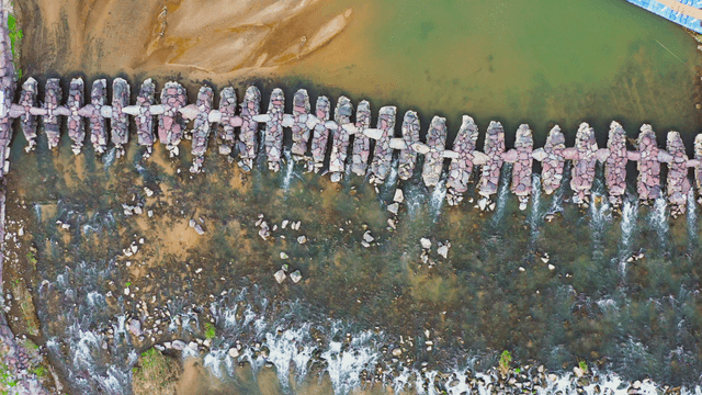 Aerial view of a stone bridge over the river