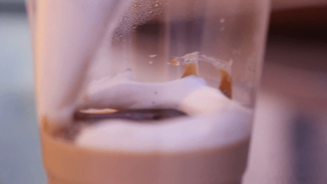 Adding vanilla cream into a cup