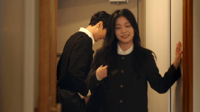 Affectionate couple entering home with smiles