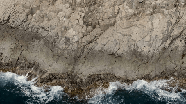 Waves crashing against rocky cliffs