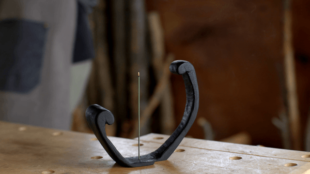Burning incense on a wooden workbench