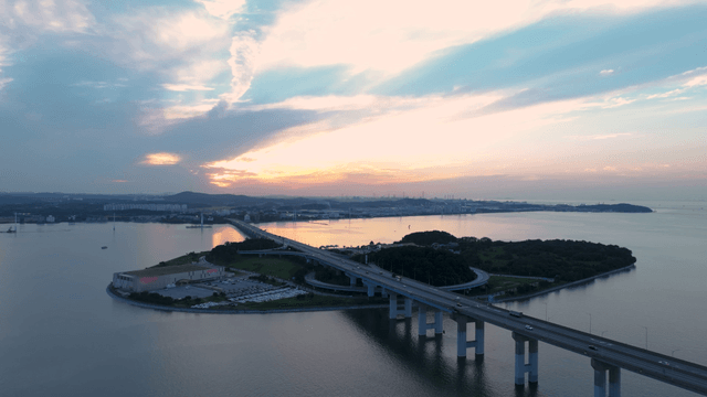 Serene sunset over a coastal bridge