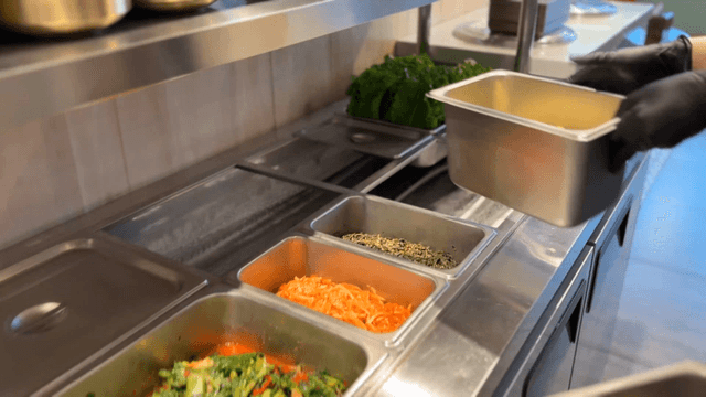 Trays of seasoned vegetables being prepared