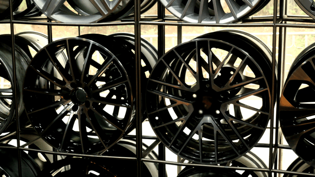 Display of various car wheels in a shop