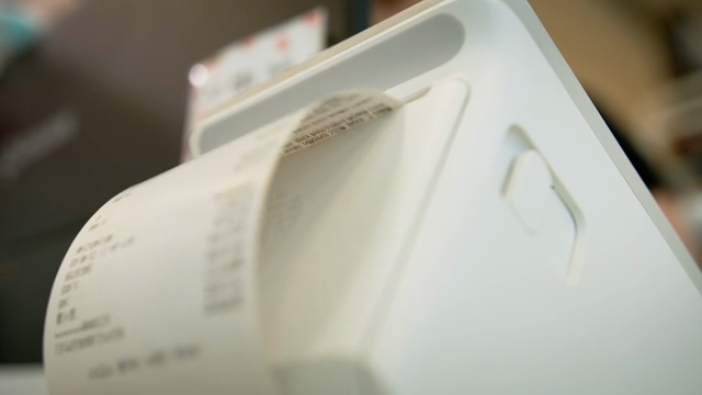 Receipt being printed from a machine