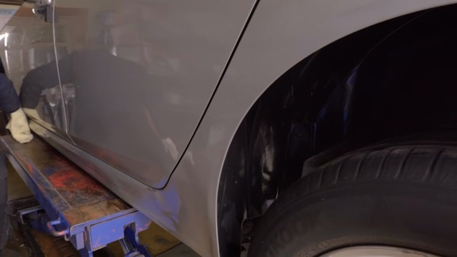 Car being polished in a workshop