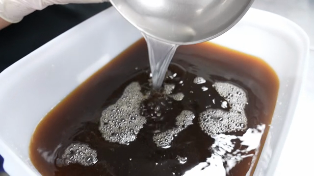 Mixing ingredients in a large container