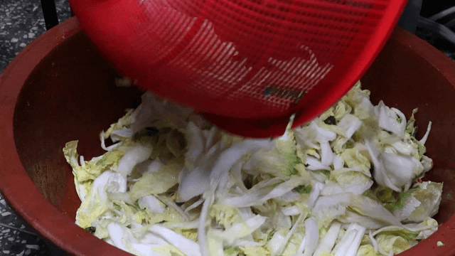 Cabbage pieces stacked in a basin