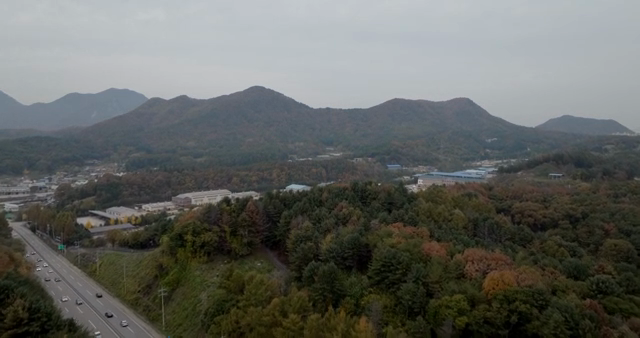 Aerial view of mountains and a nearby town