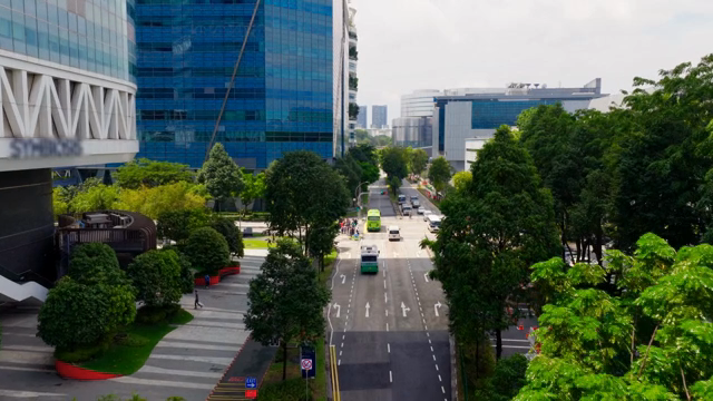 A bustling city street with tall buildings