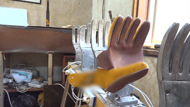 Baseball glove leather fitted on mold in workshop