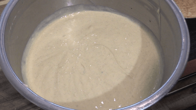 Pie cream in stand bowl on wooden table