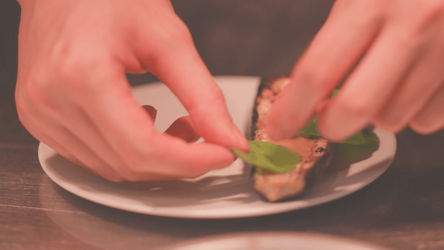Grilled eggplant topped with fresh vegetables