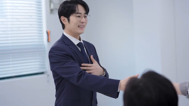A meeting scene where the signed contract is handed over