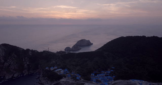 A serene island at sunset with calm sea