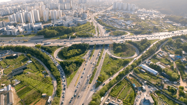 Highway interchange connecting agricultural area and city