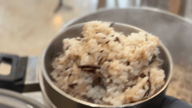 Steaming bowl of seaweed rice