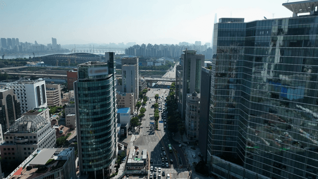 A bustling city road with skyscrapers