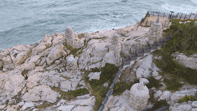 Stone tower on a coastal cliff walkway