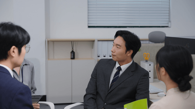 Office meeting with four colleagues
