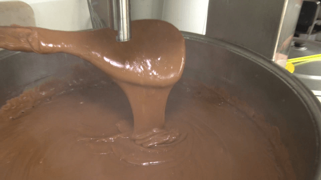 Brown sauce dripping from a spatula