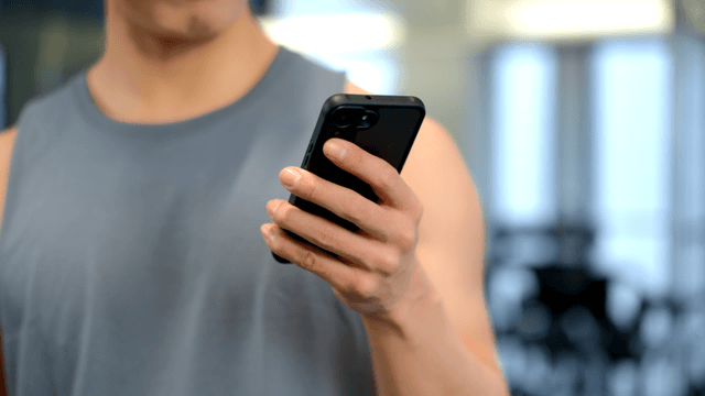 Man using only a smartphone at gym