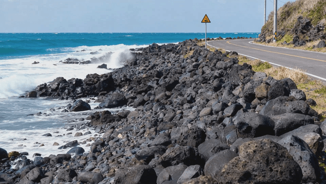 Coastal road with rocky shoreline