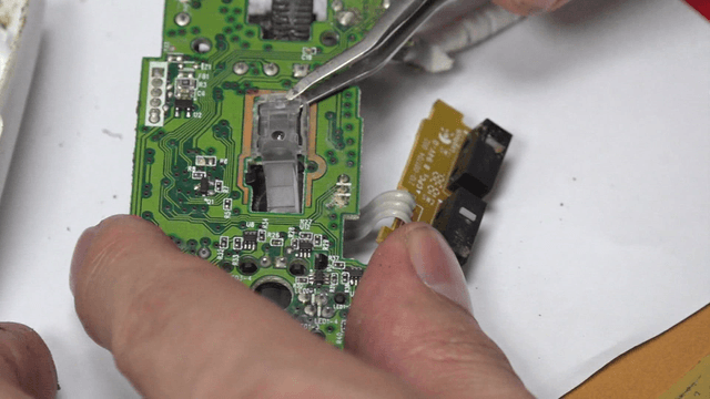 Repairing computer mouse circuit board