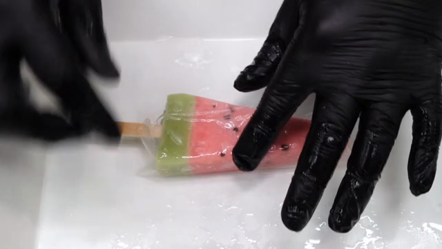 Wrapping watermelon-shaped ice cream in rice paper