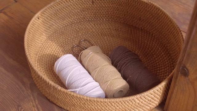 Basket with spools of thread and scissors