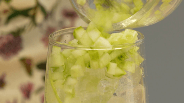 Cucumber placed in a glass with ice