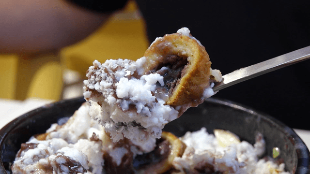 Spoon full of red bean shaved ice dessert