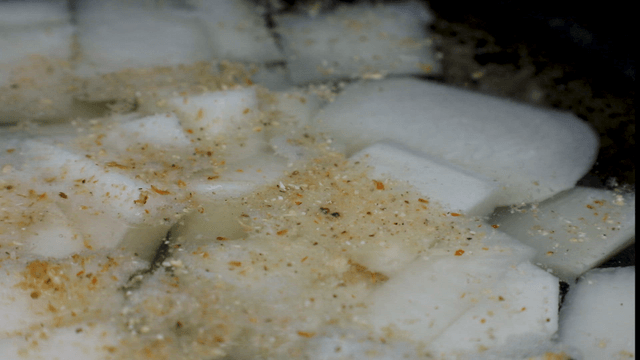 Radish slices boiling in seasoned broth