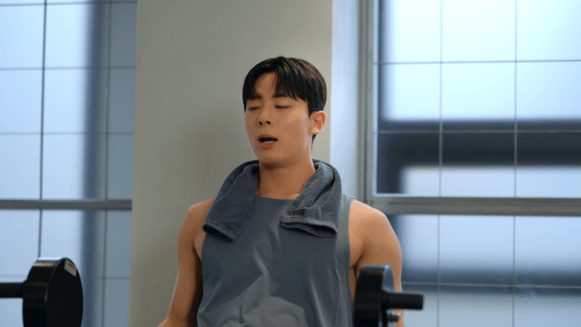 Man exercising with weights in a gym