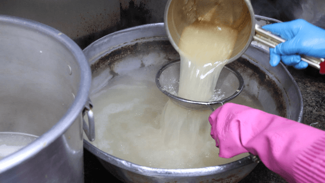 Skimmer straining broth in the kitchen