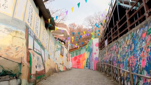 Colorful murals on alley walls