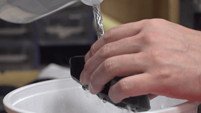 Cleaning solution poured onto a computer mouse