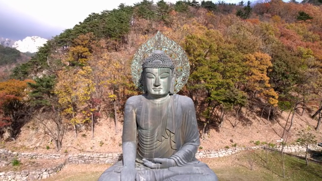 Large Buddha statue in a mountain setting